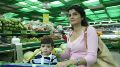 Alissar Jamil, shown shopping with her son Abdullah, says it is the poor who are suffering.