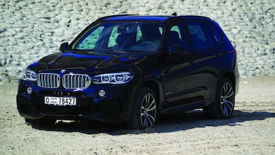 The 2014 BMW X5, the model’s third generation, boasts a subtle facelift and, in its 50i M Sport form, hits 100kph in five seconds. Christopher Pike / The National