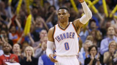 Oklahoma City Thunder guard Russell Westbrook waves to the crowd after tying the record for triple-doubles in a season in the third quarter against the Milwaukee Bucks in Oklahoma City on April 4, 2017. Sue Ogrocki / AP