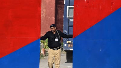 A policeman guards Adiala Jail during the hearing of jailed former Pakistan prime minister Imran Khan, in Rawalpindi. AFP
