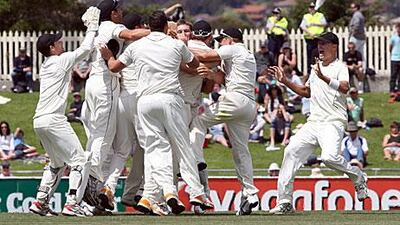 New Zealand players celebrate as they secure victory over Australia.