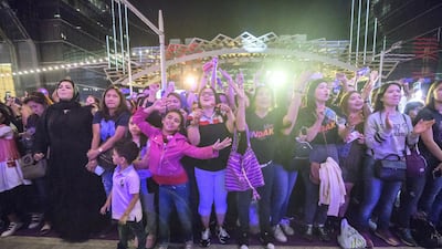 Families enjoy the entertainment.