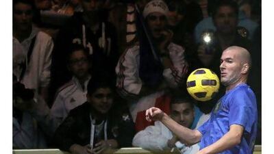 Football legend Zinedine Zidane controls the ball during a beach football match in Monaco. A reader points to Zidane as an example to young Arab football players. Valery Hache / AFP
