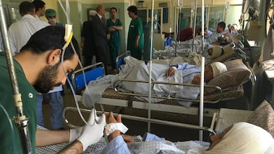 Nepalese security guards receive treatment at a hospital following a suicide attack in Kabul, Afghanistan, on Monday, June 20, 2016. At least a dozen of the guards were killed. AP Photo/Rahmat Gul