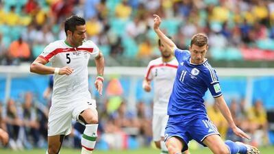 Edin Dzeko of Bosnia shoots and scores his team's first goal to make it 1-0 against Iran on Wednesday at the 2014 World Cup. Laurence Griffiths / Getty Images