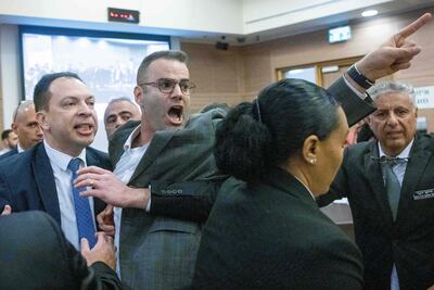 Israeli lawmakers protest inside the Knesset. AFP