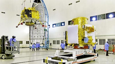 Isro scientists work on the orbiter vehicle of Chandrayaan-2, India's first Moon lander and rover mission. EPA