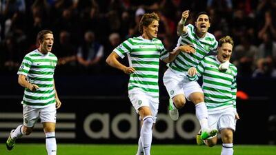 Celtic midfielder Kris Commons celebrates his opening goal against Helsingborg with teammates