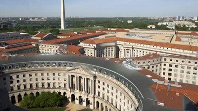The Washington Monument on the National Mall, pictured behind the Ronald Reagan Building, is part of DC's capital appeal. Hemis.fr / Getty Images