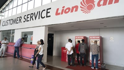 Customers use ticket machines at the Lion Air customer service area at Soekarno-Hatta International Airport in Cengkareng, Jakarta, Indonesia. Bloomberg