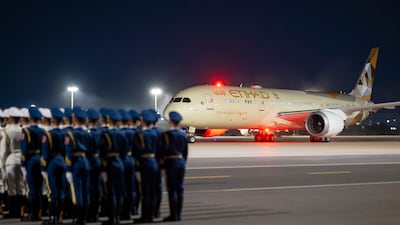 A guard of honour gathers after the Etihad Airways aircraft carrying Sheikh Mohamed lands.