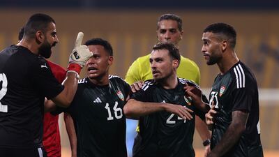 A scuffle breaks out between the UAE and Bahrain players.