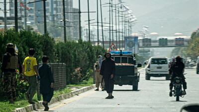 Taliban fighters stand guard along a road near the Russian embassy after a suicide attack in Kabul on September 5, 2022. AFP