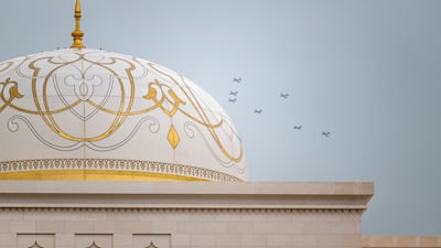 Al Fursan aerobatics team perform a fly-past during the welcoming ceremony. Omar Askar / UAE Presidential Court