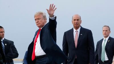 US President Donald Trump is joined by Gordon Sondland, the US ambassador to the European Union, second from right, as he arrives at Melsbroek Air Base in Brussels, Belgium. AP