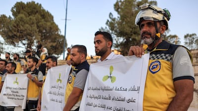 Members of the Syrian Civil Defence mark the during a vigil in the rebel-held northern city of Idlib. AFP