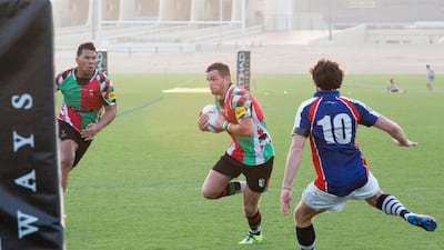 The Jebel Ali Dragons and Abu Dhabi Harliquins in action at Zayed Sports City on Friday. Duncan Chard for the National