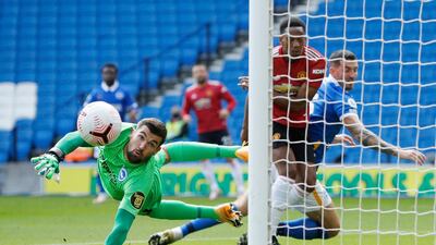 Brighton's Lewis Dunk and Manchester United's Bruno Fernandes challenge for the ball. Reuters