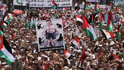 A protester holds a poster calling for the trial of Hosni Mubarak during a demonstration earlier this month in Cairo's Tahrir Square. Khaled Desouki / AFP