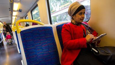 9:34am - Tasneem checks her email as she rides the train into Melbourne city.