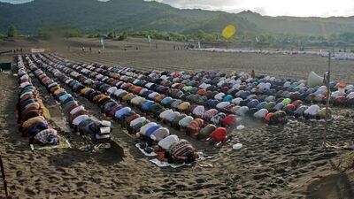 Indonesian Muslims gather for morning prayers on the sand-dunes of Parangkusumo beach, in Yogyakarta. AFP