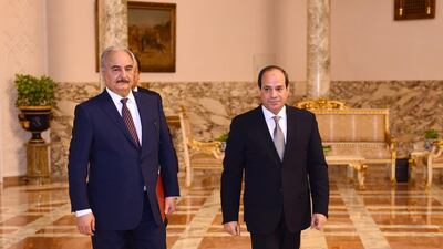 Libyan military commander Khalifa Haftar walks with Egyptian President Abdel Fattah El Sisi at the Presidential Palace in Cairo, Egypt, April 14, 2019. Reuters