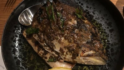 Hamachi fish head and collar at Lowe's Waste Not supper. Sophie Prideaux / The National