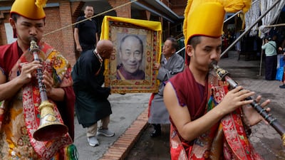 Exiled Tibetans carry a portrait of their spiritual leader the Dalai Lama, to mark his 91st birthday, in Kathmandu, Nepal. EPA