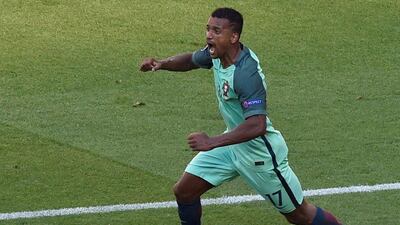 Portugal forward Nani (R) celebrates after scoring a goal during the Euro 2016 Group F football match between Hungary and Portugal at the Parc Olympique Lyonnais stadium in Decines-Charpieu, near Lyon, on June 22, 2016. Jean-Philippe Ksiazek / AFP