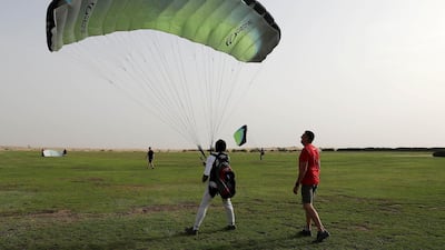 Jos Gerard Vandenbroucke, operation manager (right), with a trainee during a paragliding safety session at Skydive Dubai. Pawan Singh / The National