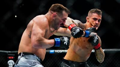 Dustin Poirier punches Michael Chandler during the first round of their lightweight bout at UFC 281. AP