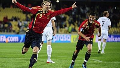 Fernando Torres, left, celebrates his first goal against New Zealand with his teammate David Villa as Spain run rampant in their opening Confederations Cup match.