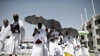 Muslim pilgrims leave after throwing pebbles at pillars during the "Jamarat" ritual in Mina near Mecca, during Haj. Mohammed Al Shaikh / AFP Photo