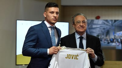 Luka Jovic poses with Real Madrid's president Florentino Perez at the Santiago Bernabeu stadium in Madrid on June 12, 2019 during his official presentation. AFP