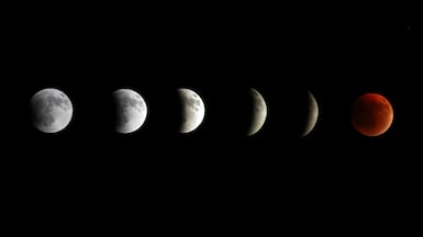 A multiple exposure image shows the phases of the lunar eclipse, culminating in the Blood Moon, above Kfardbian, in the north of Lebanon's capital Beirut. EPA