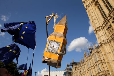 Activists display a model of Big Ben and EU flags outside the Houses of Parliament in central London. AFP