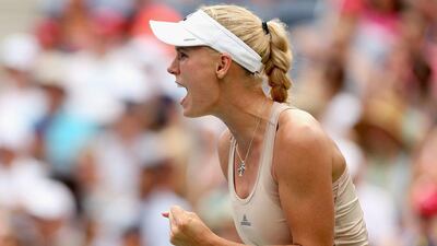 Caroline Wozniacki reacts during her fourth round win over Maria Sharapova on Sunday at the US Open. Matthew Stockman / Getty Images / AFP / August 31, 2014