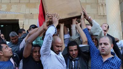 People carry the coffin of police captain Ahmed Fayez, who was killed in a gun battle on Friday. It is still unclear which militant group carried out the attack. (AP Photo/Alaa Elkassas)