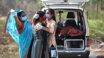 Relatives grieve as they arrive for the cremation of their loved ones who died of Covid-19 at a crematorium in Moradabad, in India's northern Uttar Pradesh state on May 5, 2021. AFP