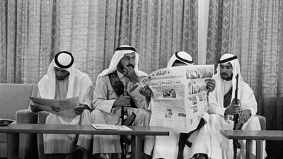 A group of palace guards relax with copies of Al Ittihad, The National’s Arabic language sister paper. Abu Dhabi, 1975.