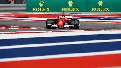 Ferrari driver Sebastian Vettel negotiates a corner. Darron Cummings / AP Photo