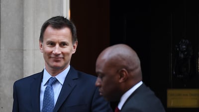 epa07398876 British Foreign Secretary Jeremy Hunt (L) departs following a cabinet meeting in 10 Downing Street. EPA/ANDY RAIN
