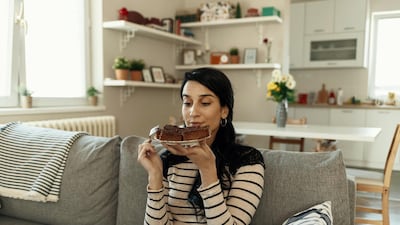Telltale signs of emotional eating can include eating in secret and overwhelming feelings of shame at the food you are consuming. Getty Images