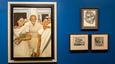 Works by Egyptian painter Ali Hassan, left, and Indian artist Akbar Padamsee, top right, depicting Indian freedom fighter Mahatma Gandhi. Photo: Jehangir Nicholson Art Foundation