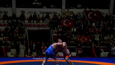 Riza Kayaalp of Turkey, in blue, and Darius Vitek of Hungary fight in the final of men's Greco-Roman 130kg category of the European Wrestling Championships in Tirana, Albania. EPA