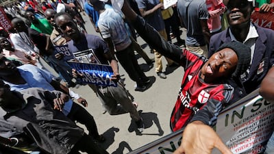 Supporters of the opposition National Super Alliance (NASA) coalition, carry banners and react during a protest calling for the sacking of election board officials involved in August's cancelled presidential vote in Nairobi, Kenya. Thomas Mukoya / Reuters