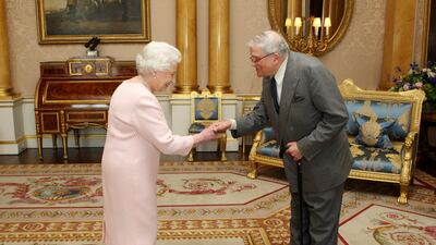 Queen Elizabeth presents artist David Hockney with the Order of Merit at Buckingham Palace. Getty