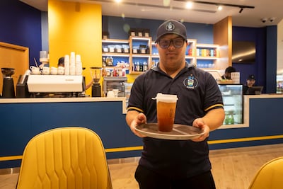 Qais Abdulsalam enjoys the independence granted to him by his job as a barista. Antonie Robertson / The National