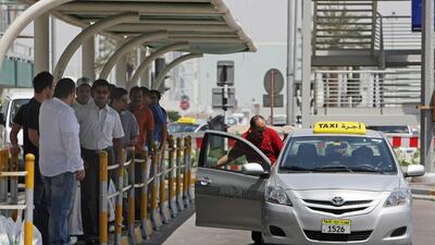 Commuters in Abu Dhabi say they have to endure long waits before they can get a taxi. Jaime Puebla / The National