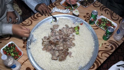 A first course of lamb and rice is served for Iftar at Ramadan for Bedouins in the Sinai. Yusri Mohammad